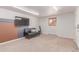 Basement space with neutral carpet, a couch, and a TV at 3501 W 53Rd Ave, Denver, CO 80221