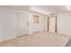 Basement space with neutral carpet and a door at 3501 W 53Rd Ave, Denver, CO 80221