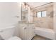 Bathroom features updated vanity with granite countertop and a tiled shower-tub combo with decor accents at 3501 W 53Rd Ave, Denver, CO 80221