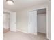 Bright bedroom features neutral carpeting, a closet, and two entrances, enhancing its functionality and charm at 3501 W 53Rd Ave, Denver, CO 80221