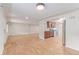 Spacious living area with hardwood floors connecting to the kitchen, featuring modern appliances and ample space at 3501 W 53Rd Ave, Denver, CO 80221