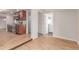 Inviting living space with hardwood floors, leading to the kitchen and a separate laundry area at 3501 W 53Rd Ave, Denver, CO 80221