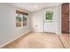 Cozy room with wood floors, a window, and a door to the exterior at 3501 W 53Rd Ave, Denver, CO 80221