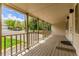 Inviting covered front porch with wood flooring and a railing, offering a relaxing outdoor space at 3501 W 53Rd Ave, Denver, CO 80221