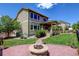 Great backyard featuring a fire pit area and lush green grass perfect for outdoor enjoyment and relaxation at 2815 Dreamcatcher Loop, Castle Rock, CO 80109
