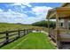 Spacious backyard with fire pit, lush lawn, and mountain views, perfect for outdoor entertaining and relaxation at 2815 Dreamcatcher Loop, Castle Rock, CO 80109