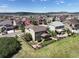 Aerial shot of home featuring fenced backyard with a built in firepit, and a view of the surrounding neighborhood at 2815 Dreamcatcher Loop, Castle Rock, CO 80109