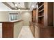 Basement bar area featuring recessed lighting, wine cooler and wooden cabinets, perfect for entertaining guests at 2815 Dreamcatcher Loop, Castle Rock, CO 80109