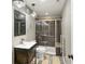 Nicely updated bathroom featuring a walk-in shower with unique hardware, a modern sink, and ample storage space at 2815 Dreamcatcher Loop, Castle Rock, CO 80109
