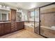Bathroom featuring dual sink vanity, soaking tub, and separate shower with bench at 2815 Dreamcatcher Loop, Castle Rock, CO 80109