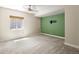 Spacious bedroom featuring carpet floors, bright window and custom painted accent wall at 2815 Dreamcatcher Loop, Castle Rock, CO 80109
