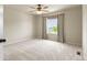 Bedroom with a ceiling fan, carpet floors, and window covered with drapery at 2815 Dreamcatcher Loop, Castle Rock, CO 80109