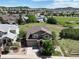 Charming two-story home with a well-manicured lawn, mature trees, and a view of the surrounding neighborhood at 2815 Dreamcatcher Loop, Castle Rock, CO 80109
