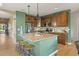 Open kitchen with central island, granite counters, and stainless appliances at 2815 Dreamcatcher Loop, Castle Rock, CO 80109