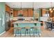 Spacious kitchen with a large island, stainless steel appliances, and a breakfast bar with stools at 2815 Dreamcatcher Loop, Castle Rock, CO 80109