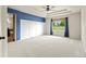 Spacious main bedroom with carpet, tray ceilings, paneling, and a view of the yard at 2815 Dreamcatcher Loop, Castle Rock, CO 80109