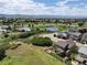 Aerial shot of a neighborhood with amenities like a pool, a pond, and well-maintained landscapes and recreational areas at 2815 Dreamcatcher Loop, Castle Rock, CO 80109