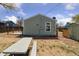 Exterior shot of the home backyard with grass and a patio at 7221 E 66Th Pl, Commerce City, CO 80022