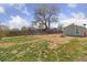 Shot of a large backyard with a picnic table and shed at 7221 E 66Th Pl, Commerce City, CO 80022