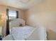 Basic bedroom with a window and full-length mirror at 7221 E 66Th Pl, Commerce City, CO 80022
