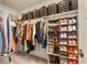 Walk-in closet with custom shelving and organization for shoes and clothes at 23920 E 34Th Ave, Aurora, CO 80019