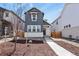 Charming two-story home featuring vertical siding, a stone accent wall, and a well-manicured front yard at 23920 E 34Th Ave, Aurora, CO 80019