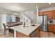 Bright eat-in kitchen featuring stainless steel appliances and a cozy dining area at 23920 E 34Th Ave, Aurora, CO 80019
