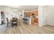 Open-concept living space featuring a dining area, modern kitchen, and staircase to the second floor at 23920 E 34Th Ave, Aurora, CO 80019