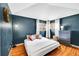 Comfortable bedroom with hardwood floors, ample natural light, and stylish furnishings at 1243 S Tejon St, Denver, CO 80223