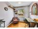 Bright home office featuring hardwood floors, a large window, and a spacious desk area at 1243 S Tejon St, Denver, CO 80223
