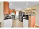 Modern kitchen with stainless steel appliances, granite countertops, and ample cabinet space at 1243 S Tejon St, Denver, CO 80223