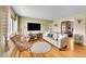 Cozy living room featuring hardwood floors, a comfortable sofa, and stylish decor at 1243 S Tejon St, Denver, CO 80223