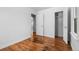 Bedroom with hardwood floors, an open closet, and neutral paint at 1570 Xanthia St, Denver, CO 80220
