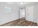 Well-lit bedroom with wood-look floors and a closet for storage at 1570 Xanthia St, Denver, CO 80220