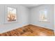 Bright bedroom with hardwood floors and two windows allowing ample natural light at 1570 Xanthia St, Denver, CO 80220