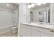 Bathroom vanity with double sinks, and shower with white backsplash at 17959 Dandy Brush Ln, Parker, CO 80134
