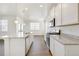 Bright kitchen with stainless steel appliances and a large granite countertop island at 17959 Dandy Brush Ln, Parker, CO 80134