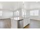 Kitchen island featuring granite countertops, modern appliances, and sleek design at 17959 Dandy Brush Ln, Parker, CO 80134