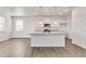 Bright kitchen with a large island, stainless appliances, and modern finishes at 17959 Dandy Brush Ln, Parker, CO 80134