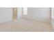 Spacious main bedroom featuring a carpet, bathroom and window at 17959 Dandy Brush Ln, Parker, CO 80134