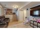 Finished basement with a TV, a sofa, stairs to the upper level, and tile floors at 321 S 26Th Ave, Brighton, CO 80601