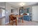 Dining room with tile floors, gray walls, a built-in cabinet, and a wooden table with chairs at 321 S 26Th Ave, Brighton, CO 80601