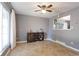 Cozy dining room with tile floors, neutral gray walls, a ceiling fan and decorative furniture at 321 S 26Th Ave, Brighton, CO 80601