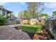 Landscaped backyard with large grassy patch, privacy fence, and detached garage at 1633 Gaylord St, Denver, CO 80206
