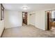 Spacious bedroom with neutral carpet, base trim and two entryways at 1633 Gaylord St, Denver, CO 80206