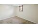Basement bedroom with neutral carpet and a window bringing in natural light at 1633 Gaylord St, Denver, CO 80206