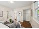 Bright bedroom with hardwood floors, neutral walls, a closet, and natural light at 1633 Gaylord St, Denver, CO 80206