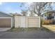 A detached garage featuring neutral siding and traditional doors, offering a functional and practical space at 1633 Gaylord St, Denver, CO 80206