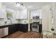 Bright kitchen with granite countertops, stainless steel appliances, and updated cabinets at 1633 Gaylord St, Denver, CO 80206