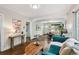 Bright and airy living room showcasing hardwood floors, comfortable seating and an open floor plan at 1633 Gaylord St, Denver, CO 80206
